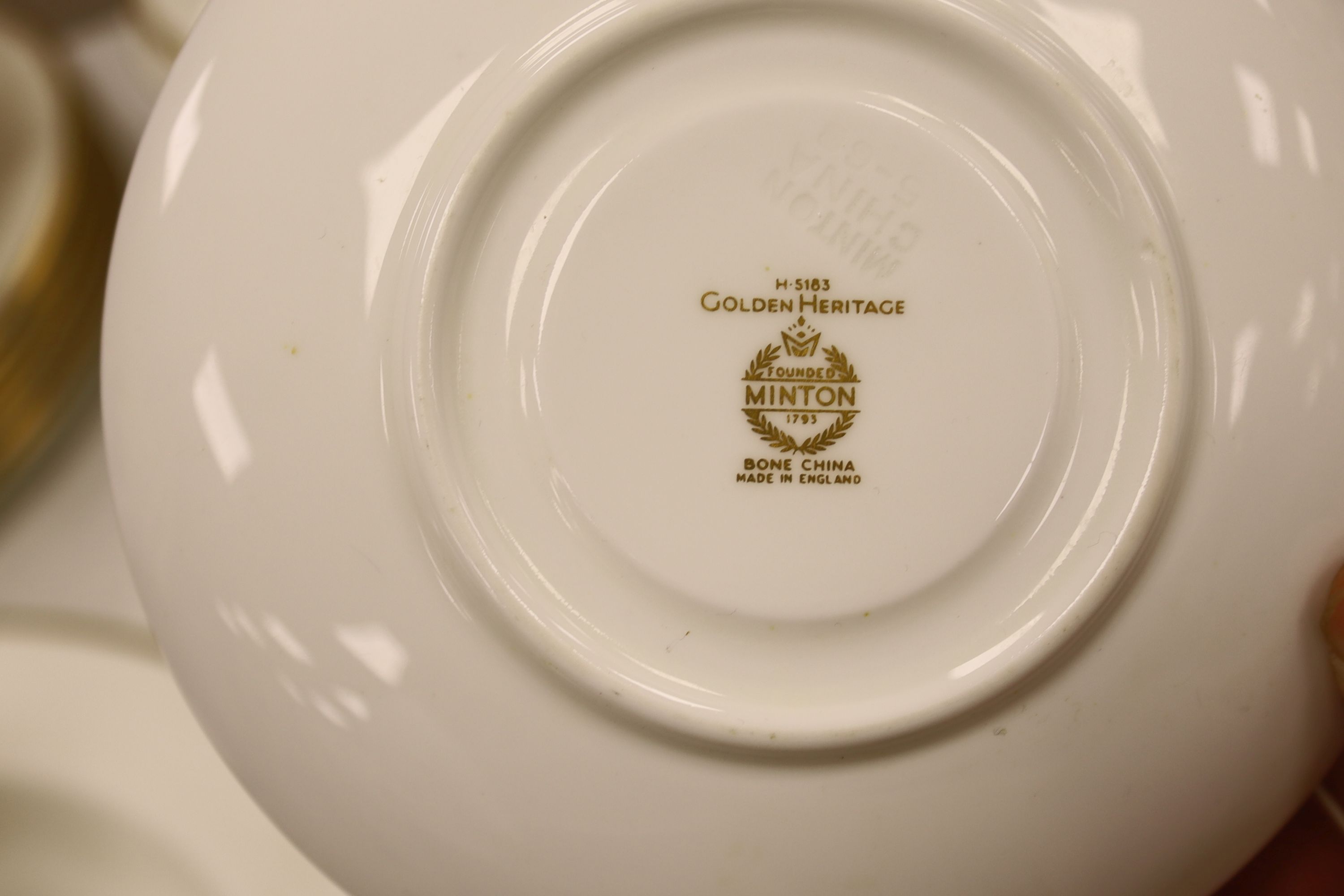 A Minton 'Golden Heritage' gilt bordered dinner service